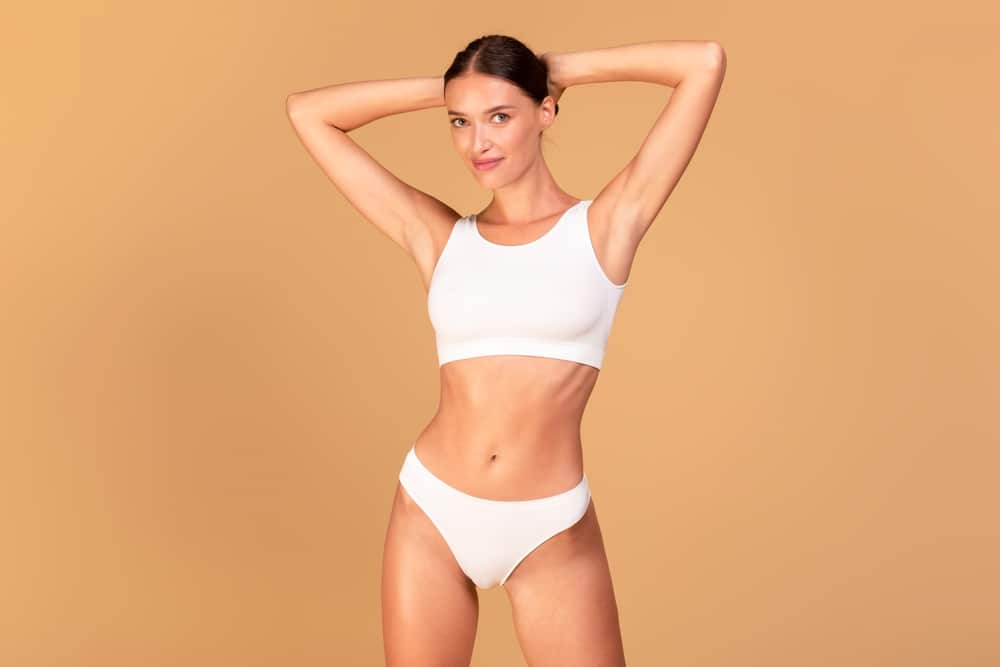 Woman with small waist after mommy makeover in Miami, FL